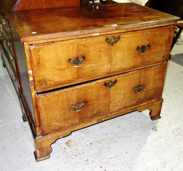 A walnut chest, the rectangular top above two deep long drawers, on bracket feet, 83cm high x 101cm wide x 53cm deep.
