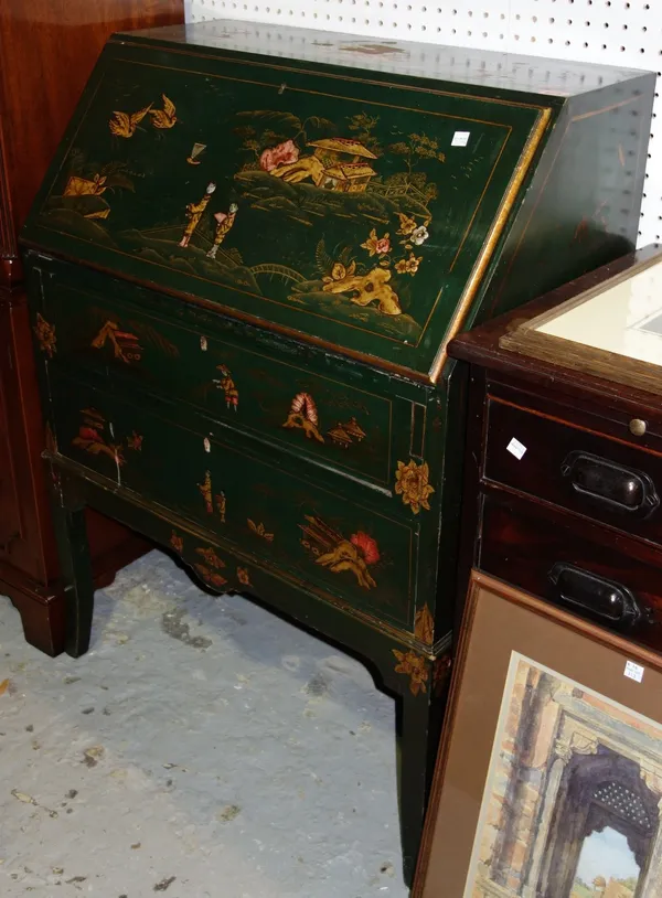 An early 20th century green lacquer chinoiserie decorated bureau, the fall enclosing a fitted interior, over two long drawers, on sabre supports, 76cm