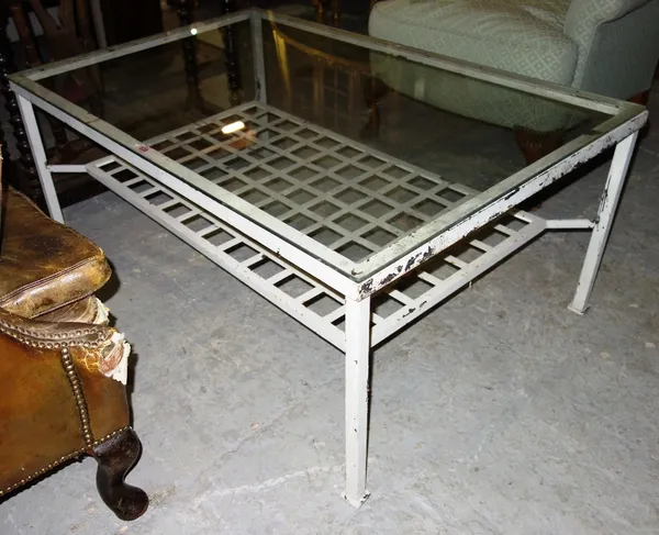 A white painted metal coffee table with glasstop, 118cm.