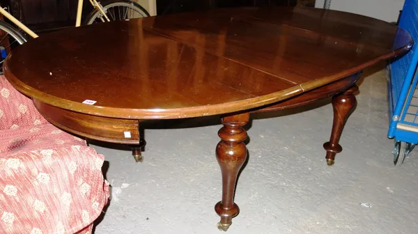 A Victorian mahogany oval dining table.