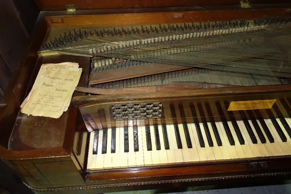 A 19th century mahogany square piano.