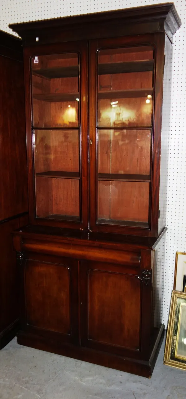 A Victorian mahogany bookcase cabinet with glazed top section and base with a pair of drawers and cupboards, 95cm wide.