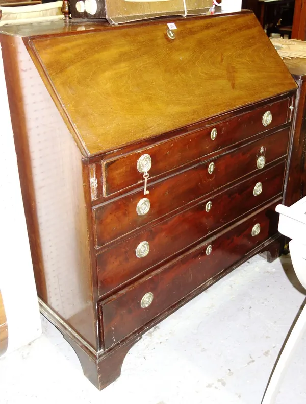 A George III mahogany bureau, the fall enclosing a fitted interior over four long graduated drawers, on bracket feet, 102cm wide.