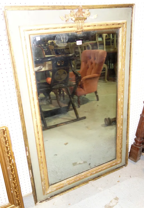 A late 19th century French parcel gilt green painted wall mirror with moulded frame, 86cm wide x 134cm high.