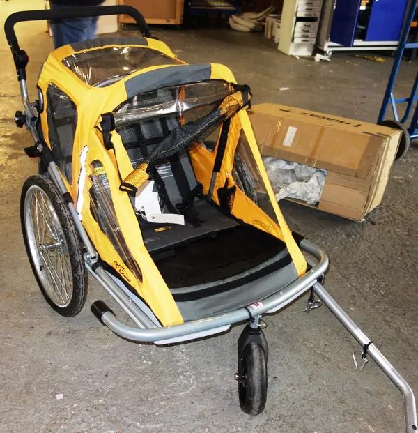 An 'Explorer' pull-behind child's bicycle trailer.