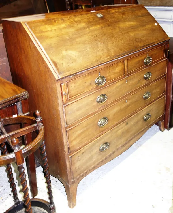 A George III mahogany bureau, the fall enclosing a fitted interior, over three short and three long graduated drawers, on bracket feet, 107cm wide.