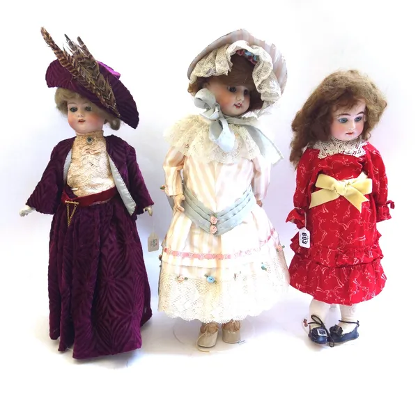 Three bisque head dolls, circa 1900 and later, comprising; Armand Marseille no.1894, a French S.F.B.J no.60, 52cm high, and a Simon & Halbig (a.f). (3