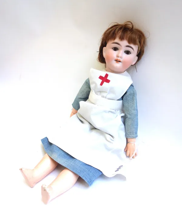 A Max Handwerck bisque head doll, Germany 2 1/4, with brown wig, sleep eyes, open mouth and composite jointed body, wearing a nurse's uniform, 46cm hi