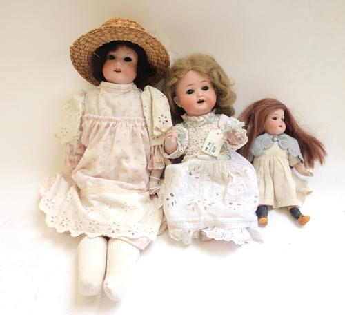 Three bisque head dolls, early 20th century, comprising; an Armand Marseille no.370 with sleep eyes and open mouth, 40cm high, a Heubach Kopplesdorf n