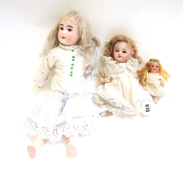 Three bisque head dolls, early 20th century, comprising; a French S.F.B.J no.60, 19cm high, a small German doll marked 'Germany 14/0, 13cm high, and o