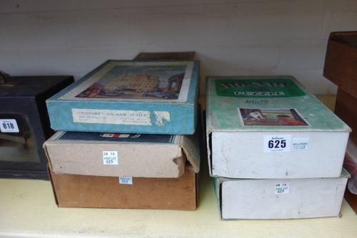 Four GWR wooden jigsaw puzzles by Chad Valley; 'The Vikings Landing St Ives', 'The Model Railway' (2) and 'Paddington Station 1862', together with a V