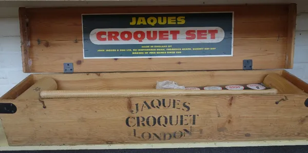 A Jaques croquet set, late 20th century, comprising four mallets, balls, iron hoops and accessories in a pine case.