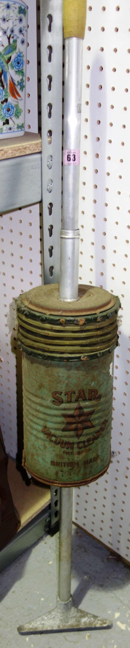 An early 20th century 'Star' vacuum cleaner.