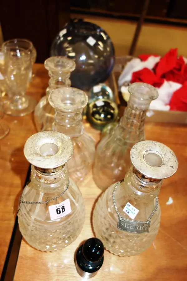 Quantity of glassware to include; pair silver mounted decanters with silver swing labels; three decanters; four paperweights; large quantity assorted