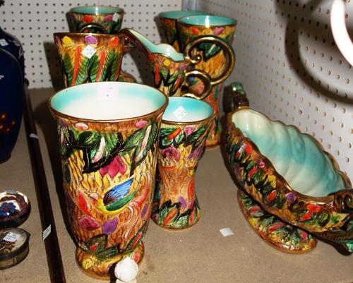 A group of 20th century ceramics, including vases, ewers and sundry, all decorated with leaves and birds, with gilt heightening. (qty)