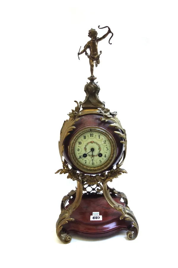 A German marble bronze mounted mantel clock, 19th century, surmounted by a figure of Cupid over a drum case enclosing a Lenzkirch two train movement,