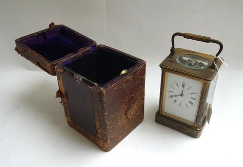 A French brass cased carriage clock, late 19th century, the white enamel dial detailed with Roman numerals, with two train movement, on a plinth base,