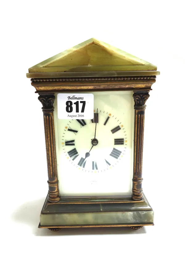 An onyx mounted brass cased carriage clock, early 20th century, with apex top and enamelled dial, flanked by Corinthian columns with a two train movem