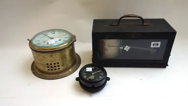 A Negretti and Zambra temperature recorder, early 20th century, in an ebonised tin case, 29cm wide, together with a North & Sons 'Watford' car clock a