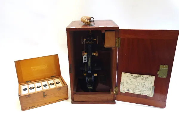 A Watson & Sons 'Service' microscope, gilt and black lacquered No.42261, in a fitted mahogany case, together with a pine microscope slide box containi