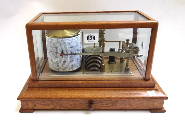 A Negretti & Zambra oak cased barograph, late 20th century, with bevelled glazed panel and a frieze drawer, 37cm wide.
