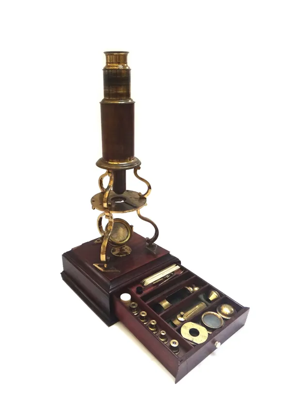 A Culpeper type brass microscope, late 18th century, engraved 'Bithray Royal Exchange, London', with a frieze drawer to the mahogany base, containing