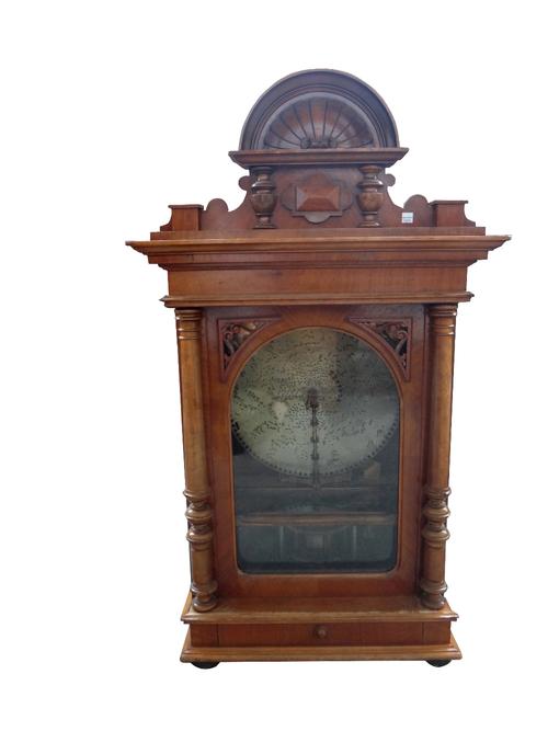 A fifteen and a half inch polyphon disc musical box, German, circa 1910, with coin operated periphery drive, in an upright case with glazed hinged doo