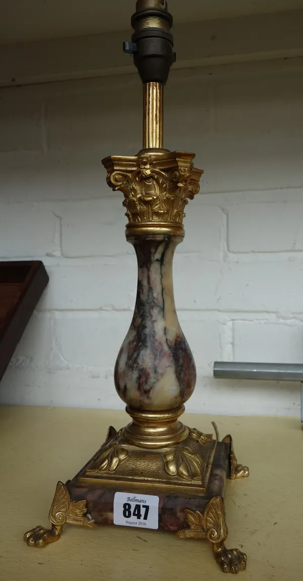A gilt metal and rosso antico marble table lamp, late 19th century, on square base and lions paw feet. 28cm high excluding fitments.