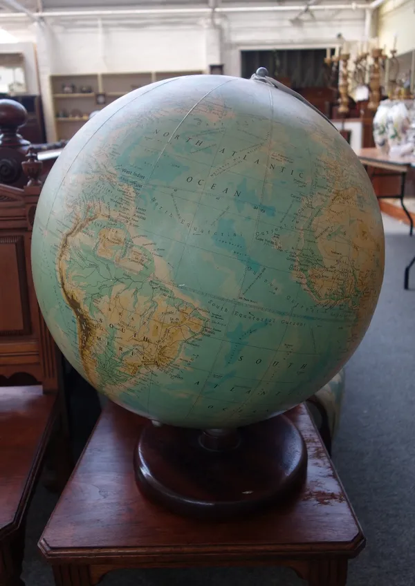 A Philips nineteen inch terrestrial globe, late 20th century, on a circular mahogany base, approx 60cm high.