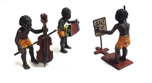 Franz Bergman (1898-1977); an Austrian miniature cold painted ten piece musical band of African natives wearing orange shorts, with impressed marks, 3