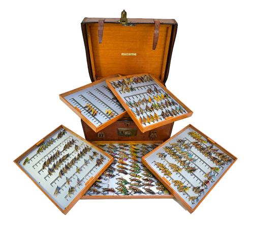 C.Farlow & Co; an early 20th century fly reservoir, contained within a heavy leather and velvet lined case, the oak box with a hinged lid opening to r