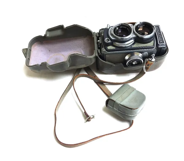 A Rolleiflex 'baby grey' twin lens reflex camera, circa 1960, serial number 2048750, cased.