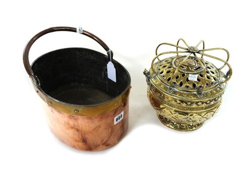 An early 19th century copper and brass swing-handled oval saucepan, a 19th century Dutch brass jardiniere, three mortars and two pestles, and an unusu