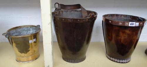 A leather and copper bound shot bucket, possibly 18th century, with studded decoration, 28cm high, together with a larger similar version with leather