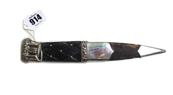 A Scottish sgian dubh, hallmarked Edinburgh 1915, the blackwood handle with carved knotwork decoration interspersed with metal studs, the pierced foli