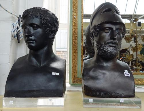 Two black painted plaster busts, late 20th century, each depicting a Greek mythological figure, both mounted on a clear perspex plinth. Tallest bust 5