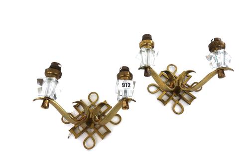 Three pairs of gilt brass and cut glass two branch wall appliques, mid 20th century, in the manner of Jules Leleu, 15cm high. (6)