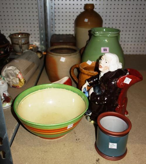 A 19th century Staffordshire figure of The Night Watchman, a Clarice Cliff bowl retailed by Liberty's, a Boars Head biscuit, a green glazed Devonshire