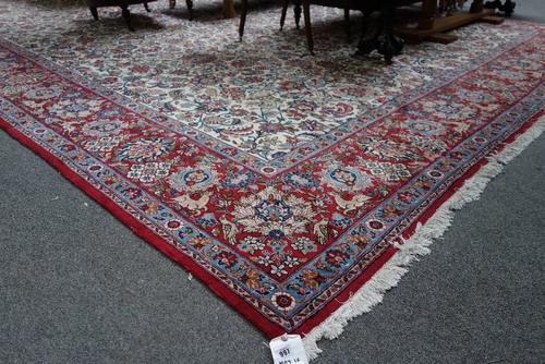 A Kashan carpet Persian, the ivory field with an allover design of floral sprays, animals and birds; a madder palmette, floral spray and animal border