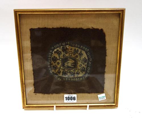 A collection of items to include; an early Coptic needlework fragment of roundel form with central rabbit decoration, the roundel 10cm diameter; a lon
