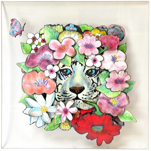 'Diane' after Fleur Cowles, an enamelled collage tableau depicting a white tiger head amongst flowers, signed and dated '86 (small losses), set on a p