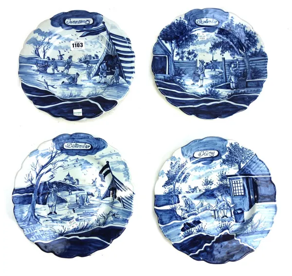 A set of twelve Dutch Delft calendar plates, early 20th century, each decorated with differing landscape or interior scenes and titled with each month