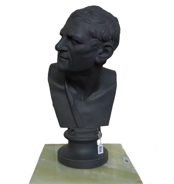A Wedgwood style black basalt ware bust depicting a Greek philosopher, raised atop a socle, 54cm high.  17
