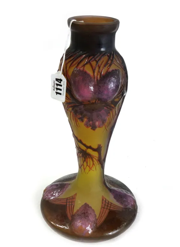 A Galle style glass lamp base relief decorated with purple blooms against a yellow ground on a wide spreading foot, signed Galle, 28cm high.