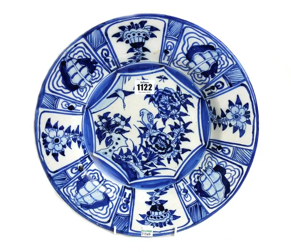 A Continental blue and white tin glazed earthenware dish, probably Dutch, late 18th/19th  century, painted in Chinese kraakporselein style in the cent