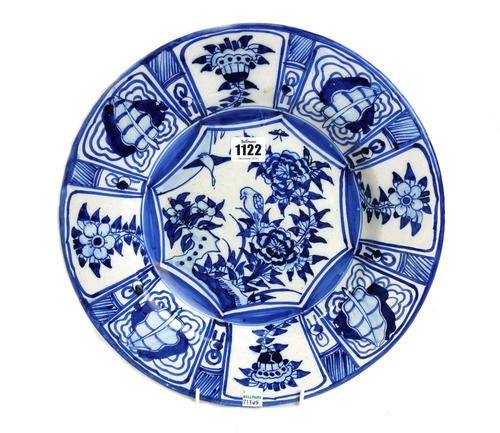 A Continental blue and white tin glazed earthenware dish, probably Dutch, late 18th/19th  century, painted in Chinese kraakporselein style in the cent