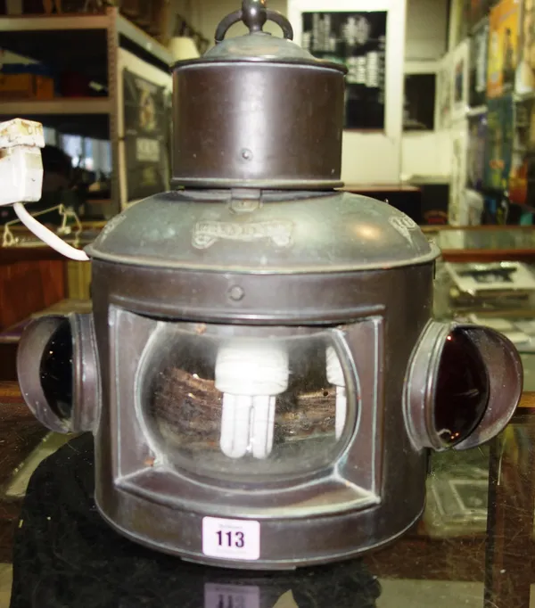A copper ships lamp fitted for electricity.   CAB