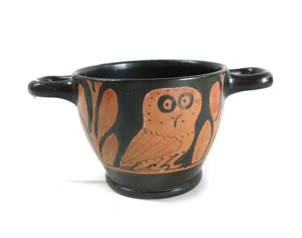 An attic red figured owl skyphos of two handled form, circa 5th-4th century B.C., decorated each side with an owl flanked by laurel branches (restored