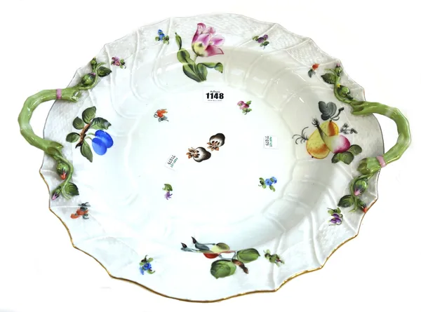 A Herend porcelain part dinner service decorated in the `Fruits and Flowers' pattern comprising; a circular two handled dish (43.3cm across the handle