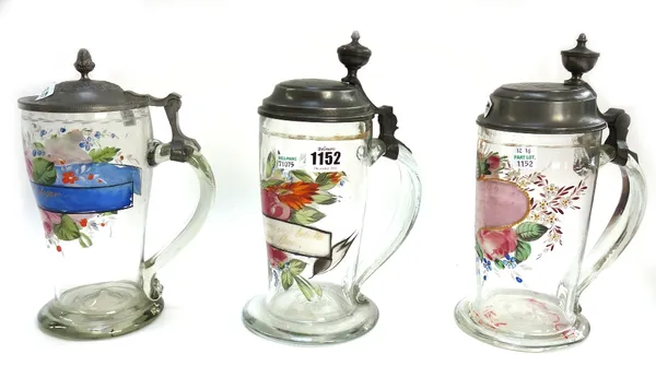 A quantity of glass wares, 19th/20th century, including; three German glass and pewter mounted tankards each hand painted with flowers and detailed wi